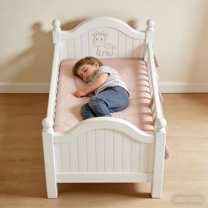 GiraffeHaven Toddler Bed: The Carved White Wood Kids’ Bed with Macramé Accents